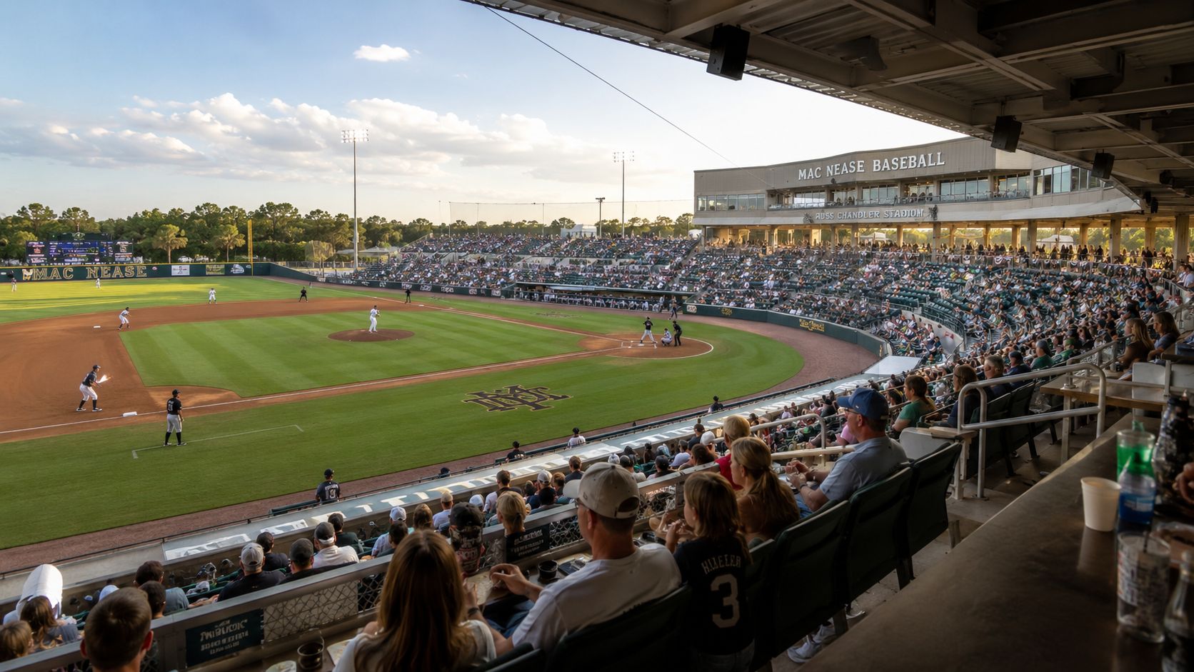 A wide angle view of the Russ Chandler Stadium during a Georgia Tech baseball game at sunset.